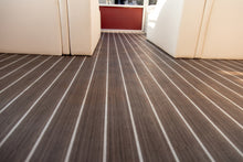 Load image into Gallery viewer, Dark Nutmeg Teak Light Holly pattern vinyl flooring installed on boat