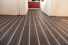 Load image into Gallery viewer, Dark Nutmeg Teak Light Holly pattern vinyl flooring installed on boat
